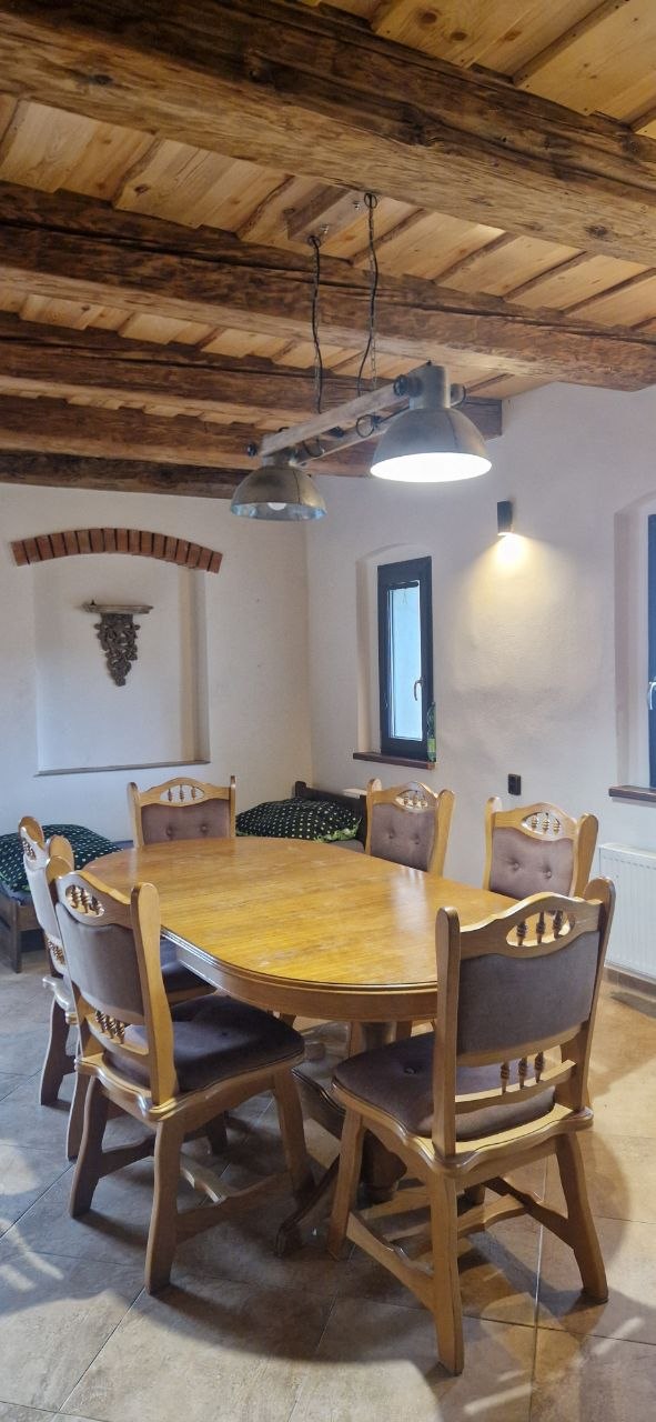 Dining room with exposed beams