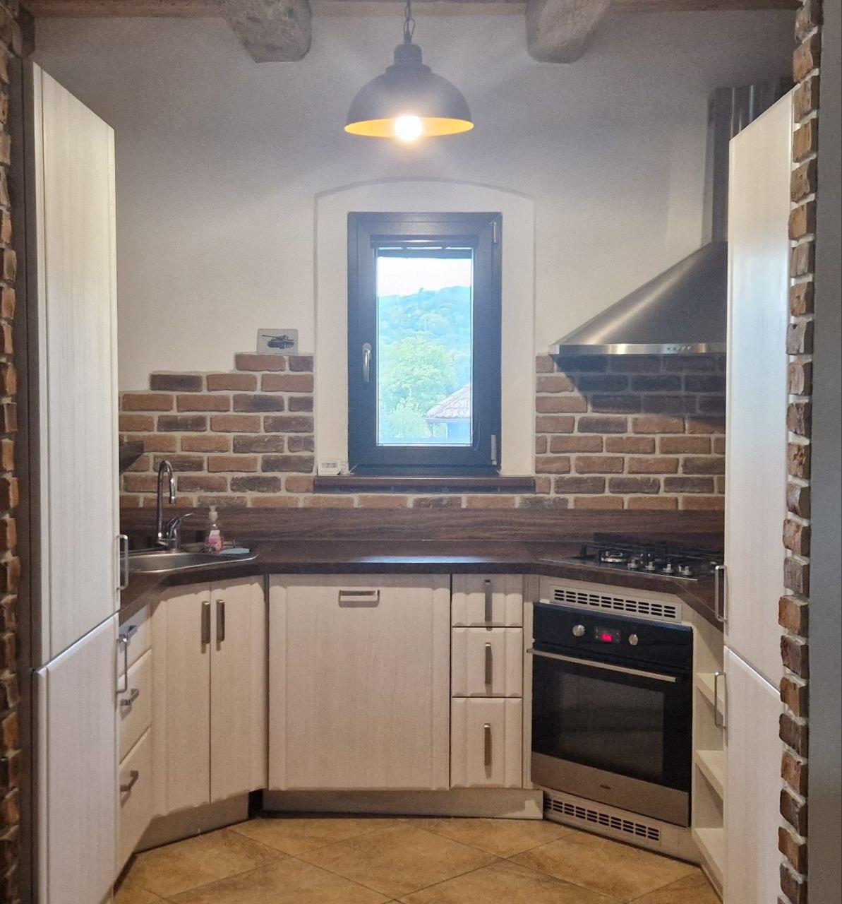 Kitchen with brick backsplash